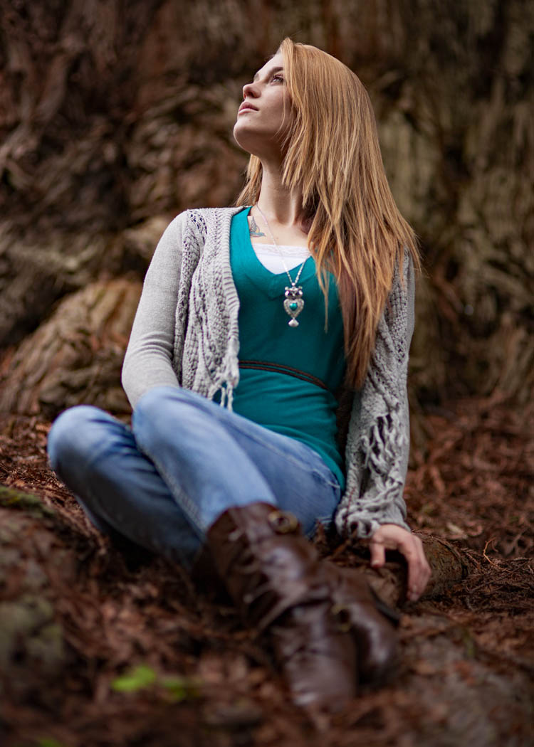 girl posing between spring flowers