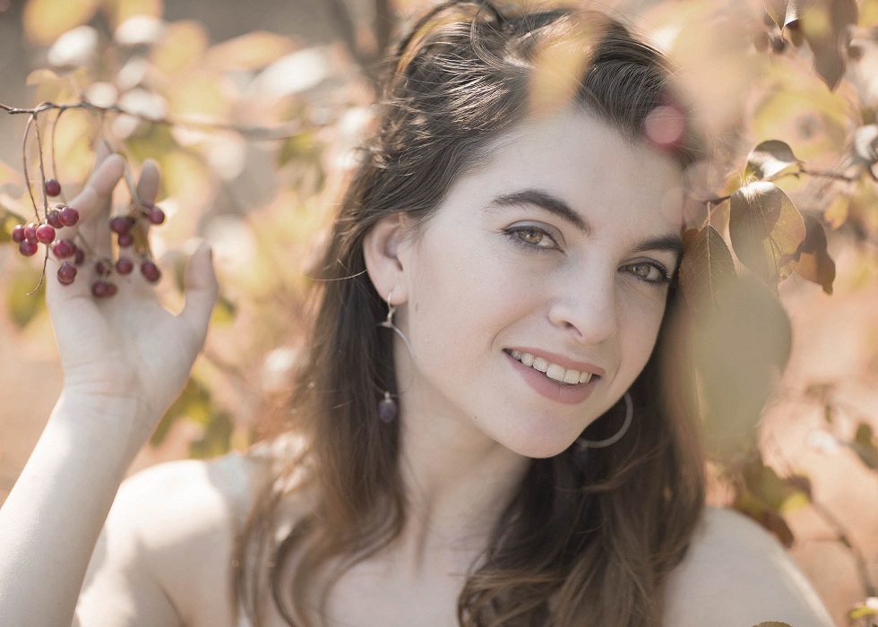outdoor portrait ashland oregon college student under tree with berries