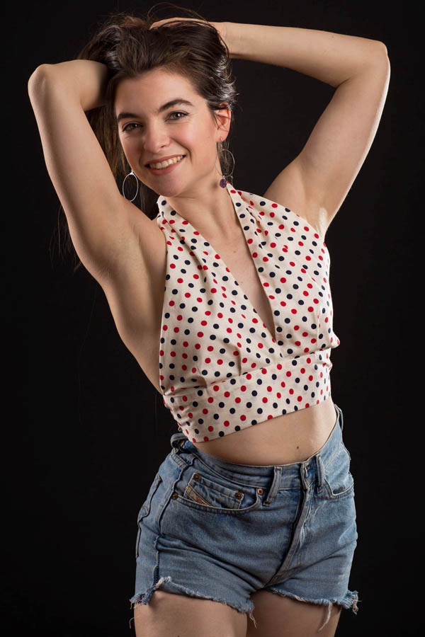 blonde entertainer wearing shorts shirt and smiling
