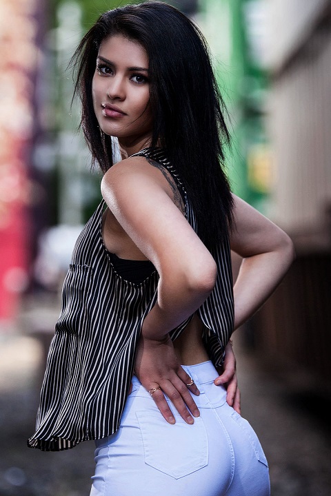 brunette hispanic woman helping photographer test new 200mm lens
