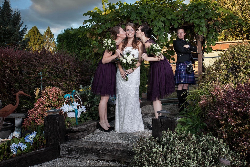groom watching bridesmaids and bride at oregon wedding reception